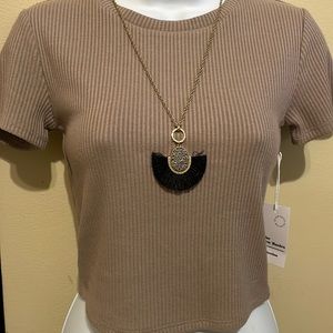 Top and necklace sold separately!
